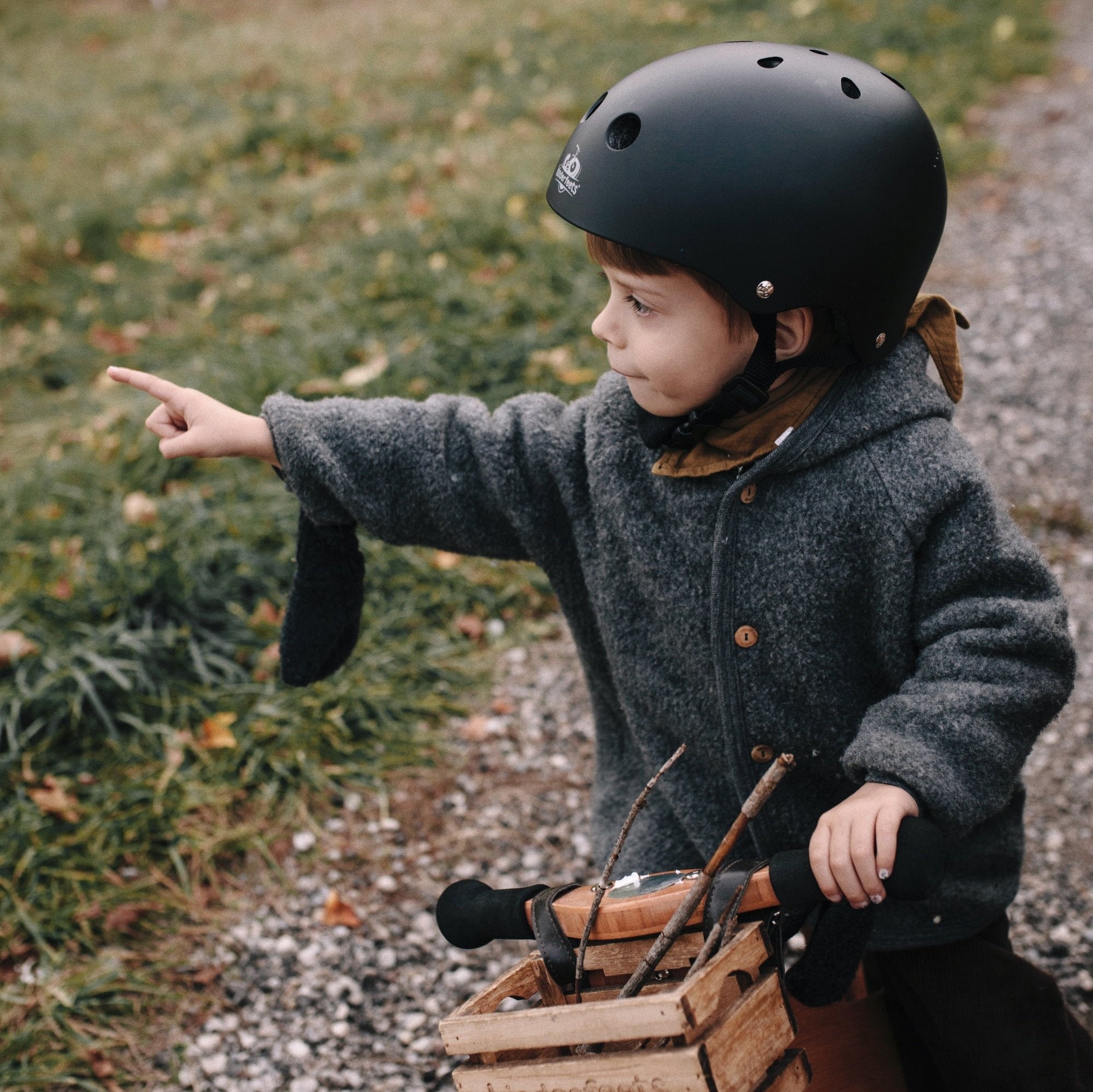 Kinderfeets Toddler Bike Safety Helmet in Matte Black. Adjustable Fit Dial System and padded chin strap provide additional comfort while an ABS outer shell and EPS liner ensure child safety.