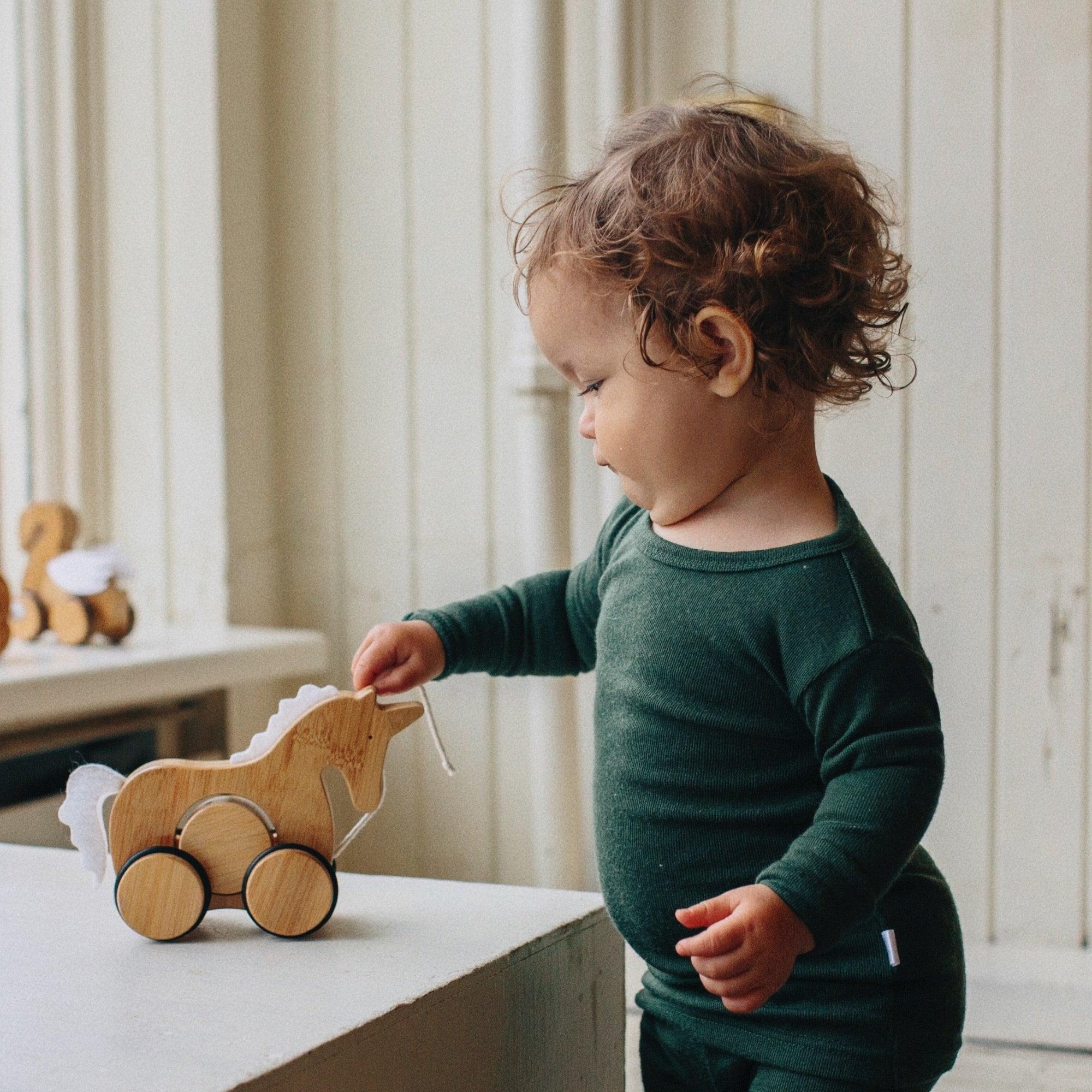 Sustainable wooden toys - eco friendly - push and pull toy - bamboo - rubber rimmed wheels - safety release mechanism - toddlers - playtoy - Kinderfeets New Zealand - Unicorn