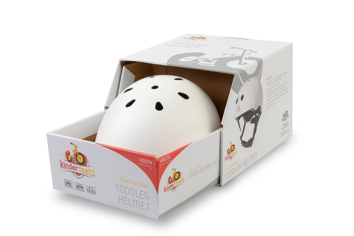 Kinderfeets Toddler Bike Safety Helmet in Matte White. Adjustable Fit Dial System and padded chin strap provide additional comfort while an ABS outer shell and EPS liner ensure child safety.